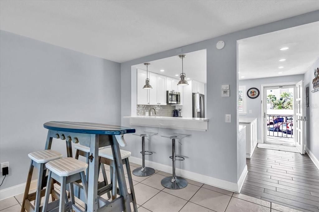 Dining room area and breakfast bar.  The home is tiled throughout