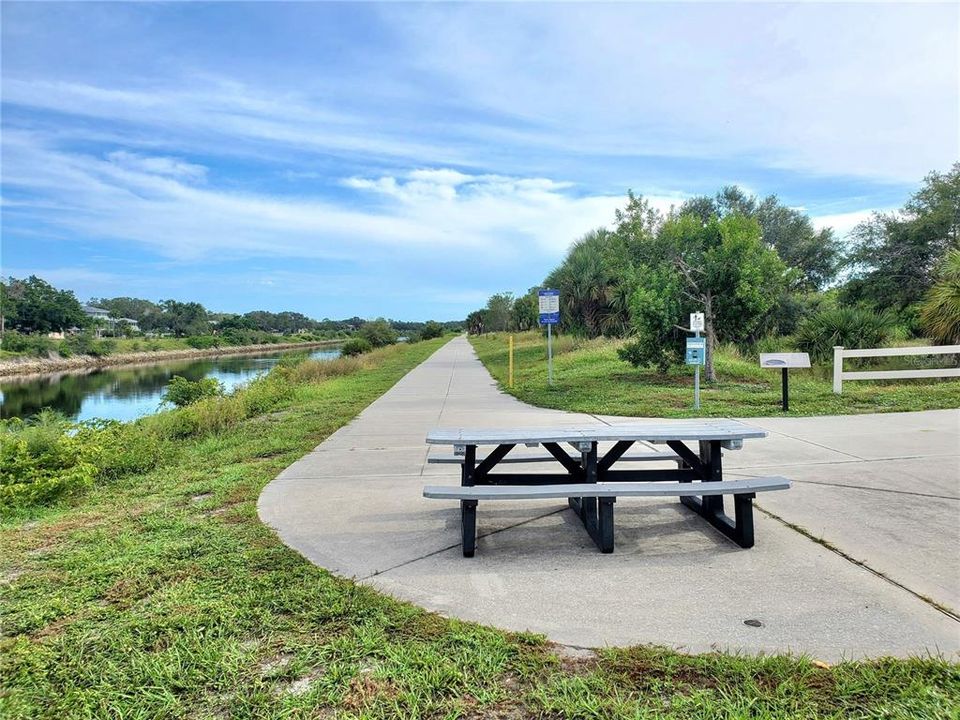 picnic table along the Venetian Waterway Trail by the airport