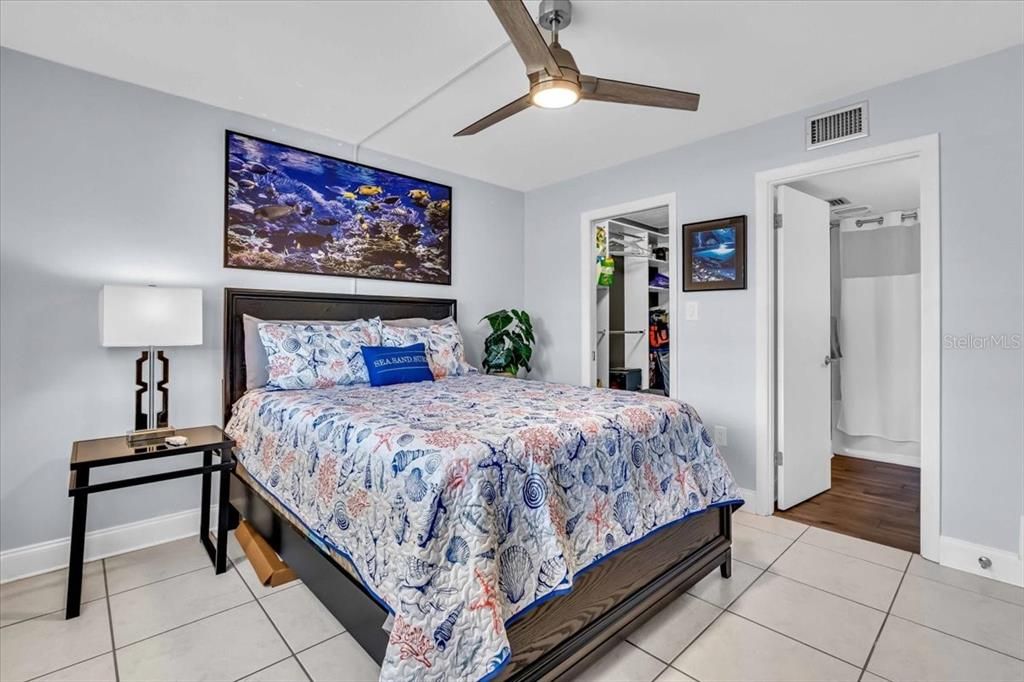 bedroom showing space and entry to closet and bathroom