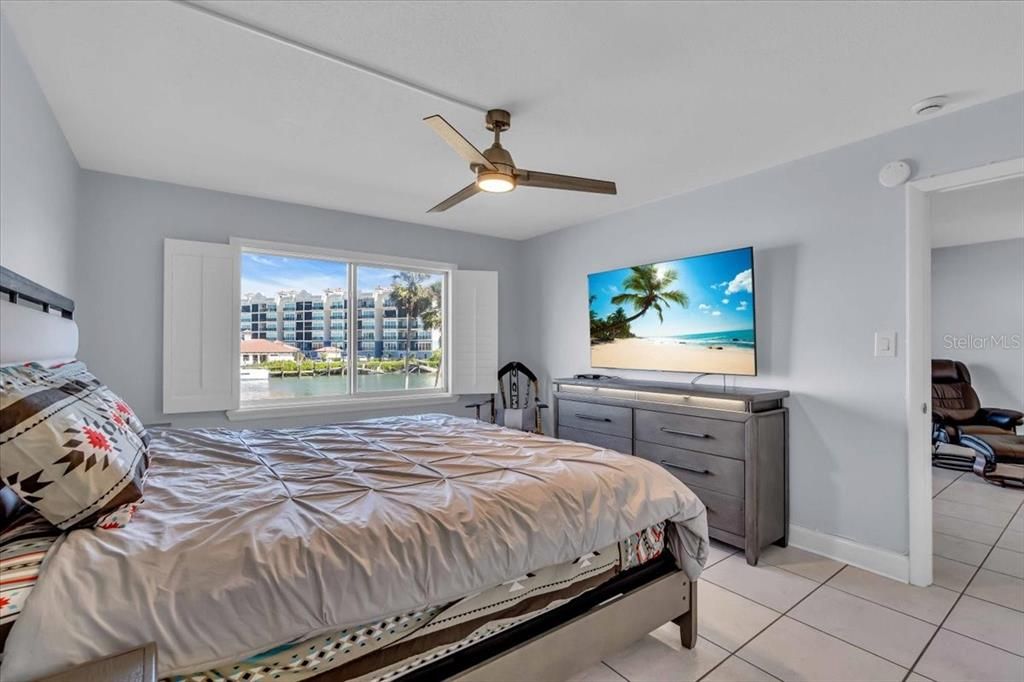 The master suite has great water and sunrise views from the bed. It is large enough for king size bed if desired. There is a ceiling fan as well.  Furnishings are optional