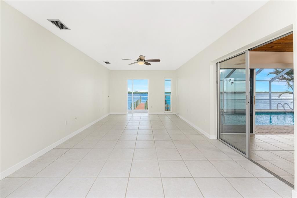 Living Room with FL Rm to the right & pool