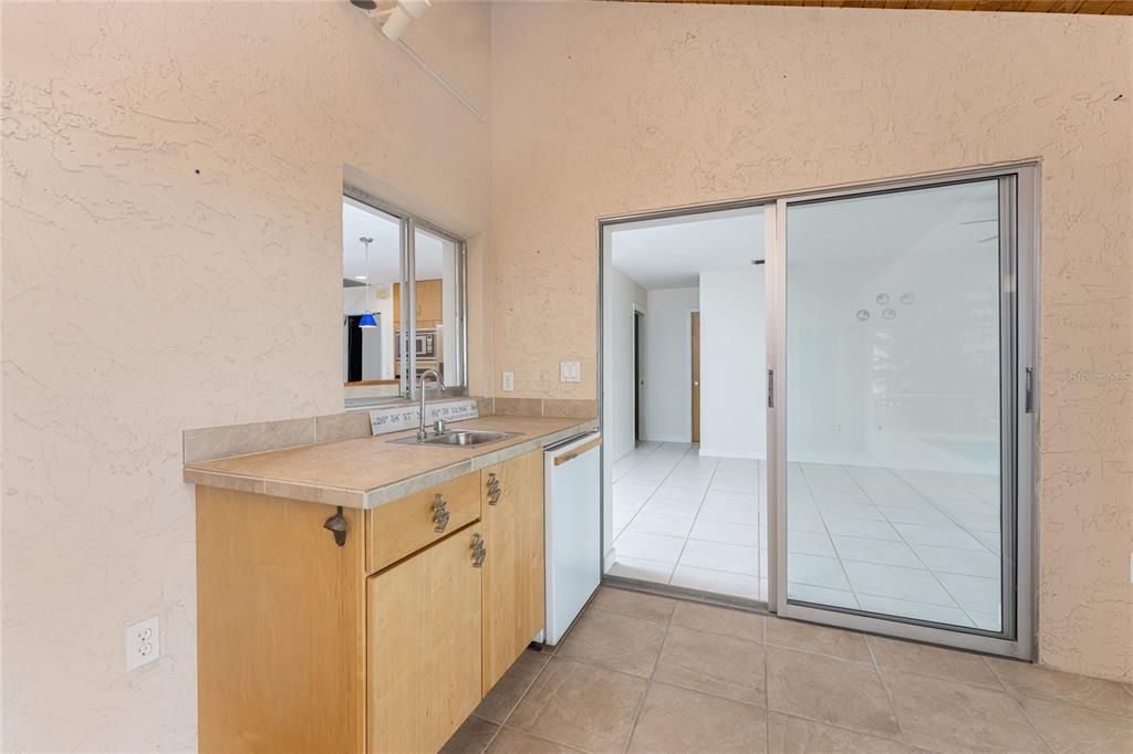 Wet bar in Florida Room. Looking across Living Room to hall to secondary bedrooms.