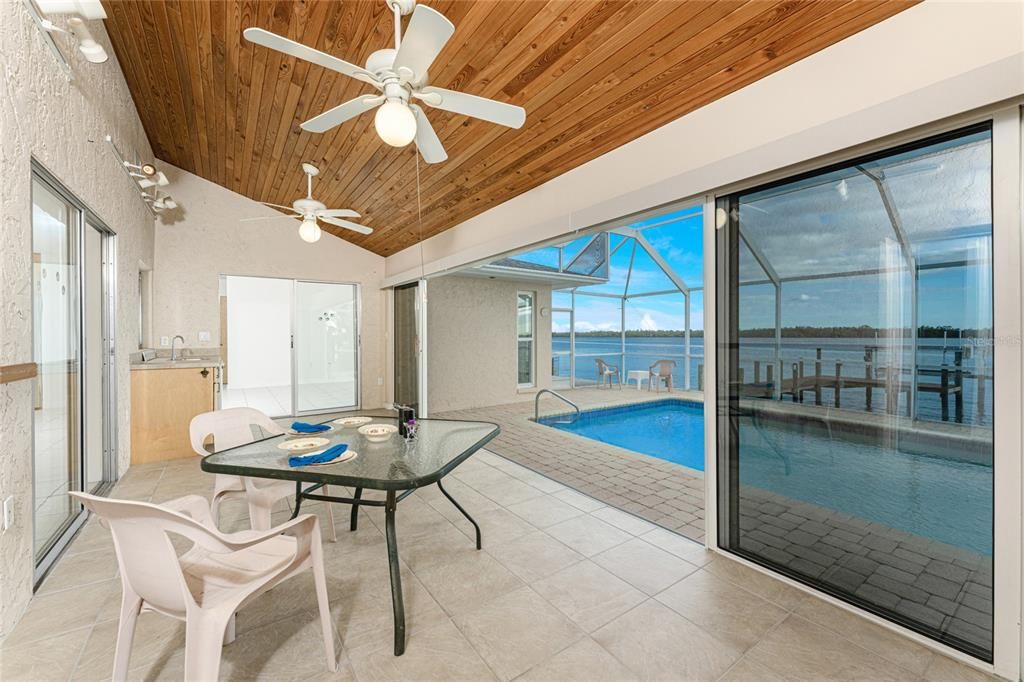 Florida Room has the flexibility to be conditioned or open for poolside fun.