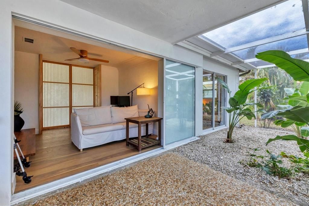 Third Bedroom and Master Bedroom Living Area flowing out to the Enclosed Lanai.