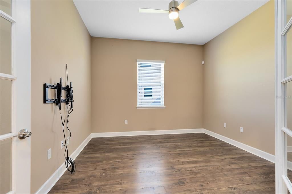 The study/home office, accessed through elegant French doors, could easily be converted into a fourth bedroom with the addition of a closet.