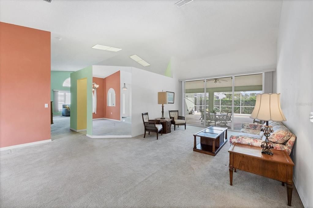 Bright formal living room overlooking the pool