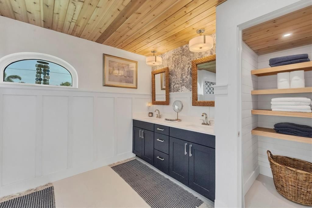 Cedar tong and groove ceilings with double sinks.