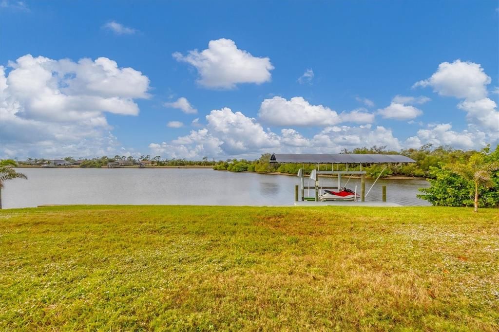 Large back yard with sea wall and 10,000 pound boat lift with access to the Peace River and beyond.