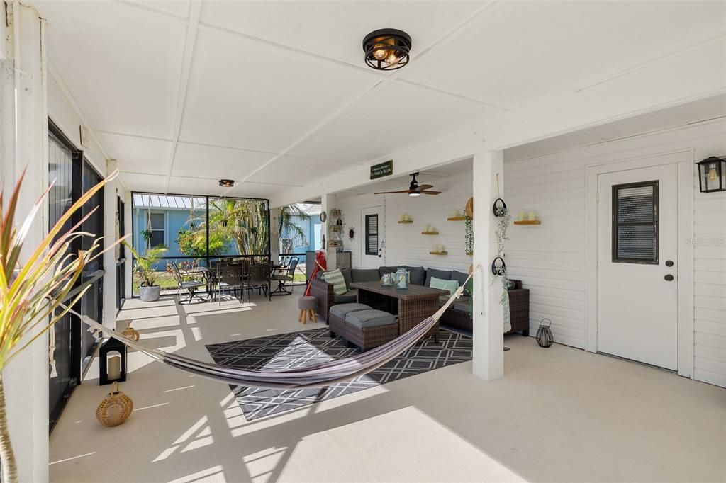 First level screened patio with access to the gym, bathroom and garage