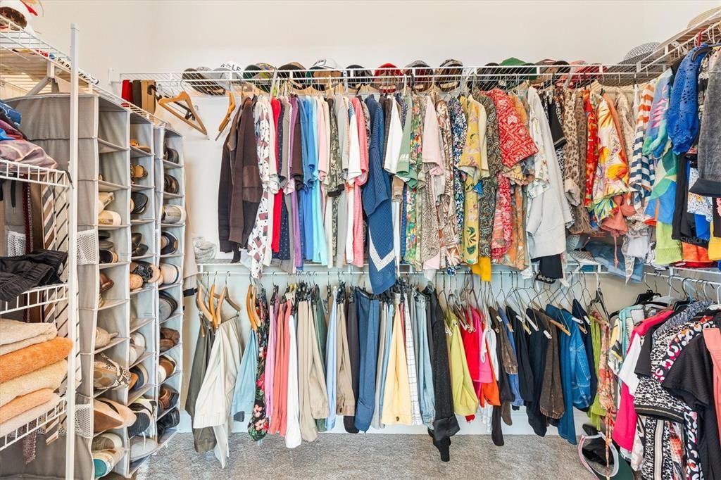 Walk in closet in primary bedroom