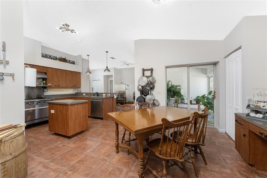 Another view of dining area and kitchen