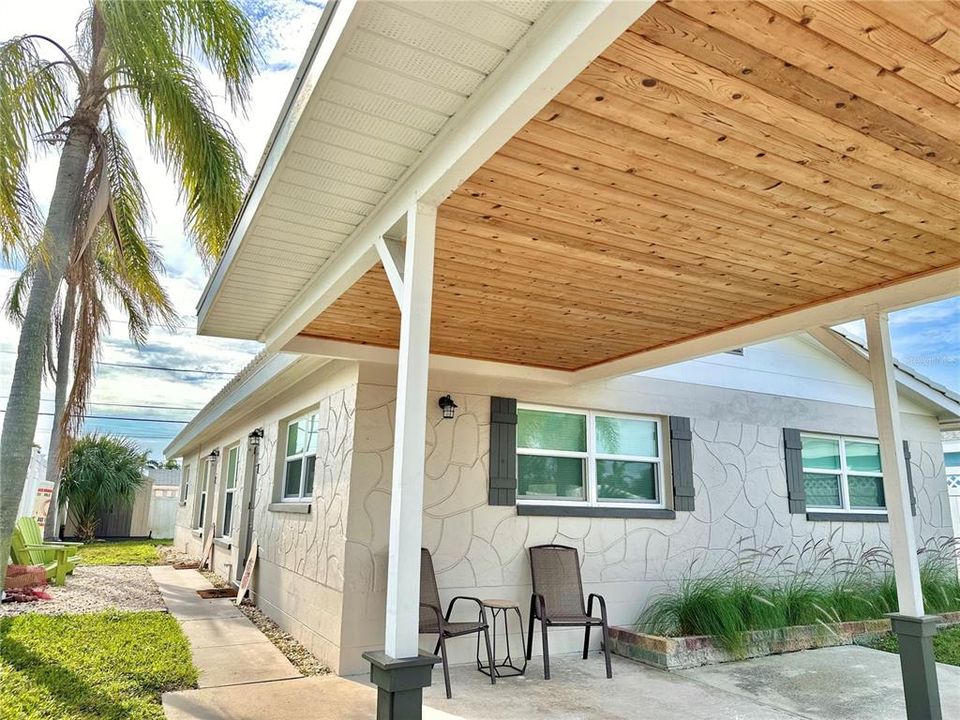 Oversized 4-car driveway with 1 covered carport space