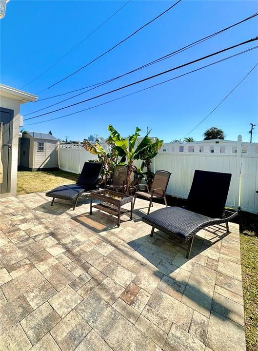 Paver patio around the rear of the building