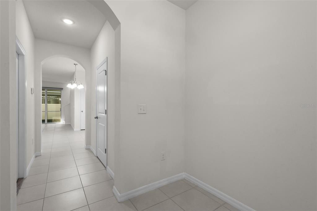 Entry - photographed showing hallway to living/dining/kitchen