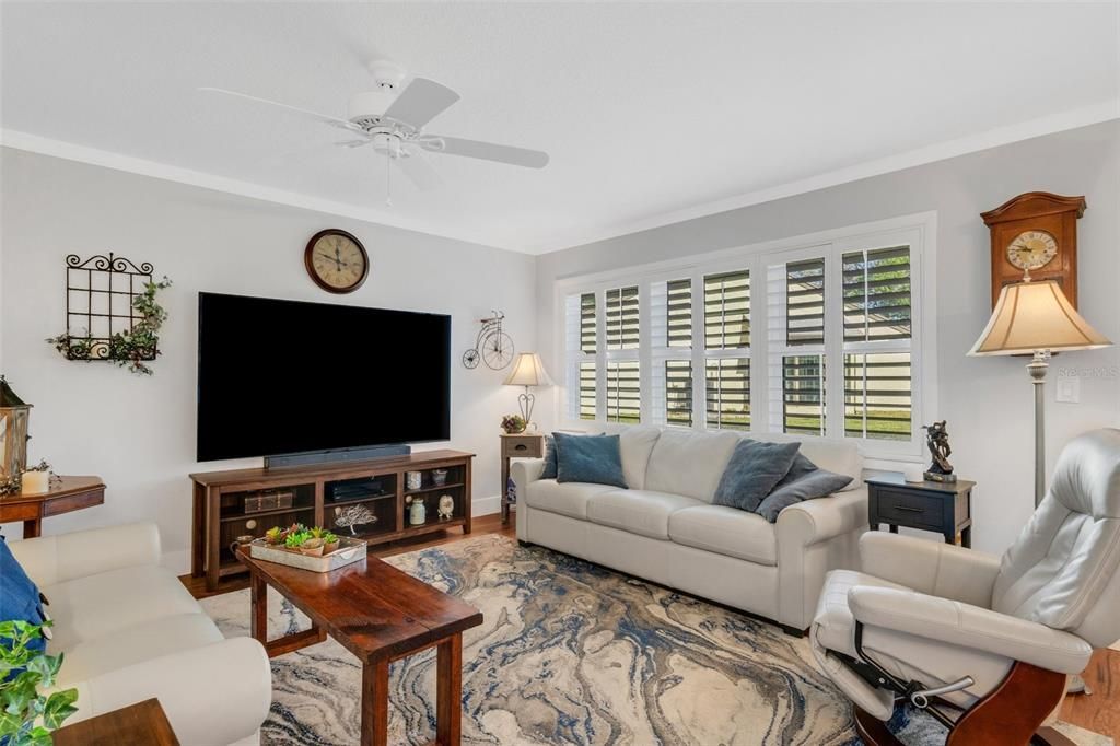 New crown molding, baseboards, & plantation shutters throughout~