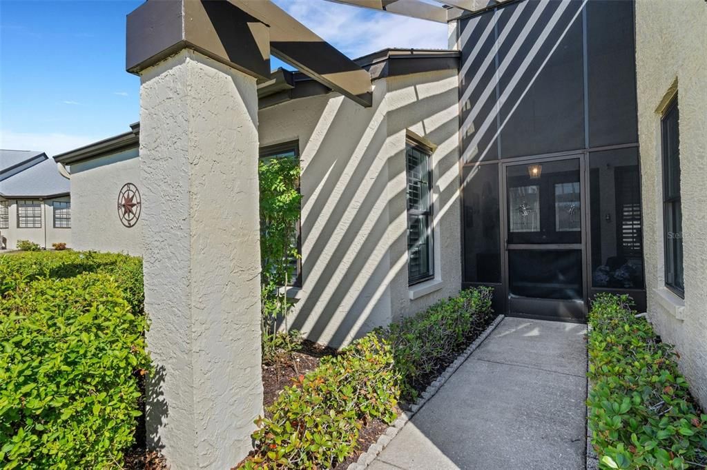 Welcoming entry to screen enclosed front porch~