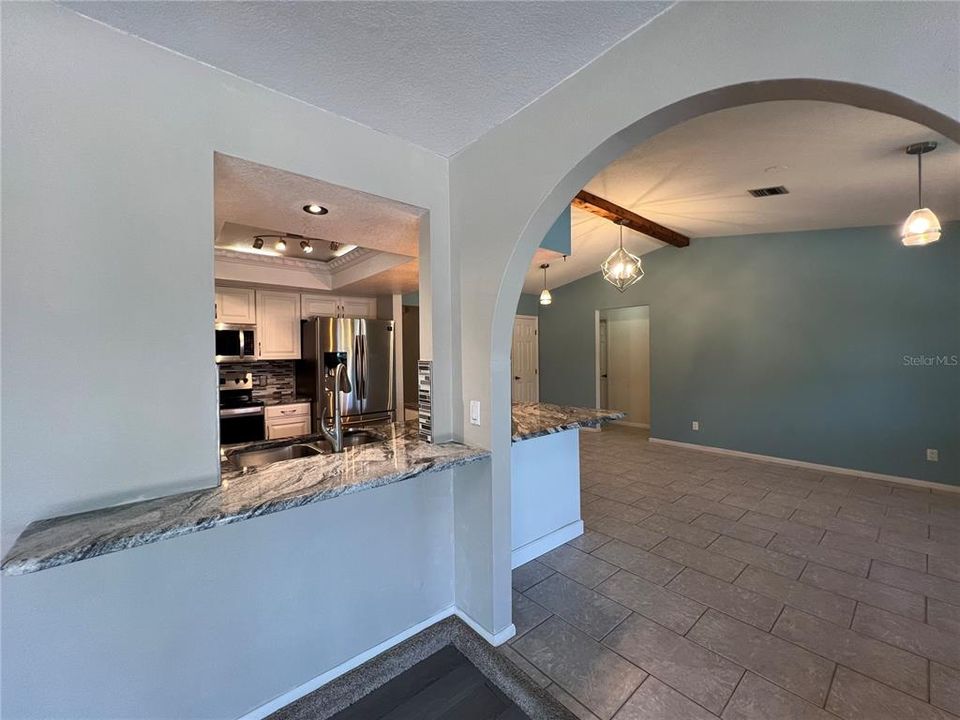 View from to the Bonus Room!! Need More Barstools? Notice here the granite bar countertop area too!