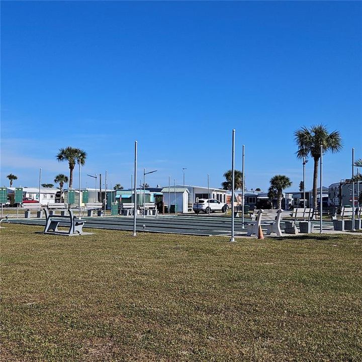 Shuffleboard courts with bocce ball behind them