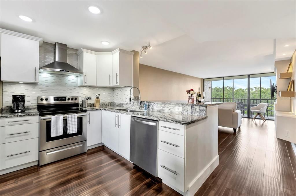 Open layout with a beautifully upgraded kitchen & stainless steel appliances