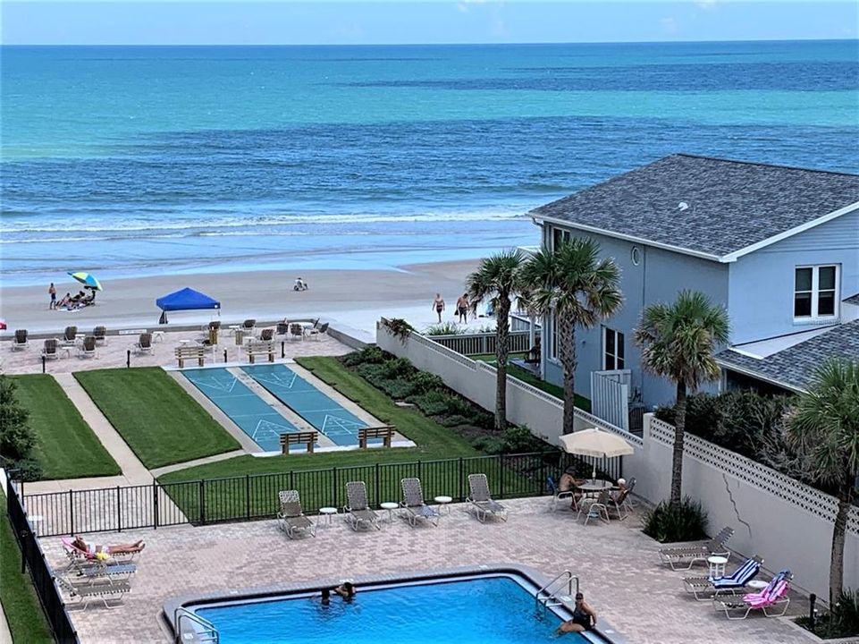 House to the right has been torn down.  New one to be built further from beach.