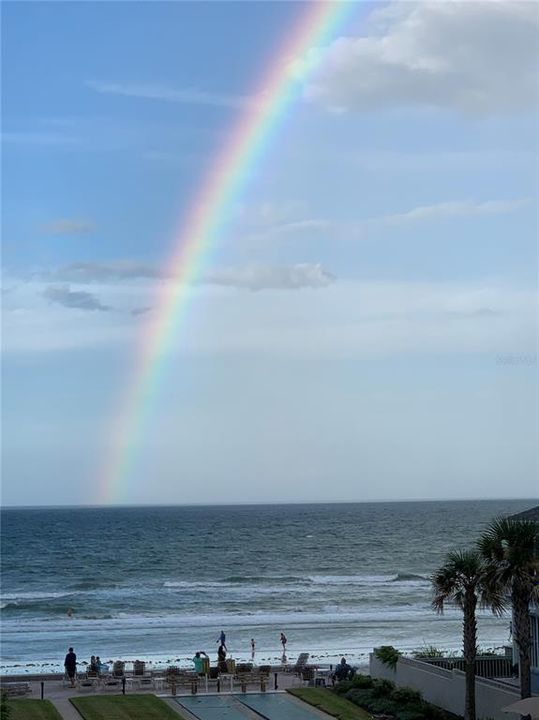 Rainbow over ocean.