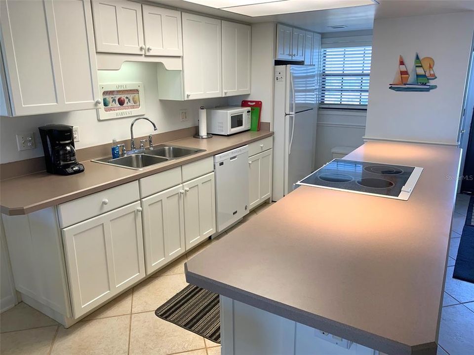 Kitchen with cooking island.