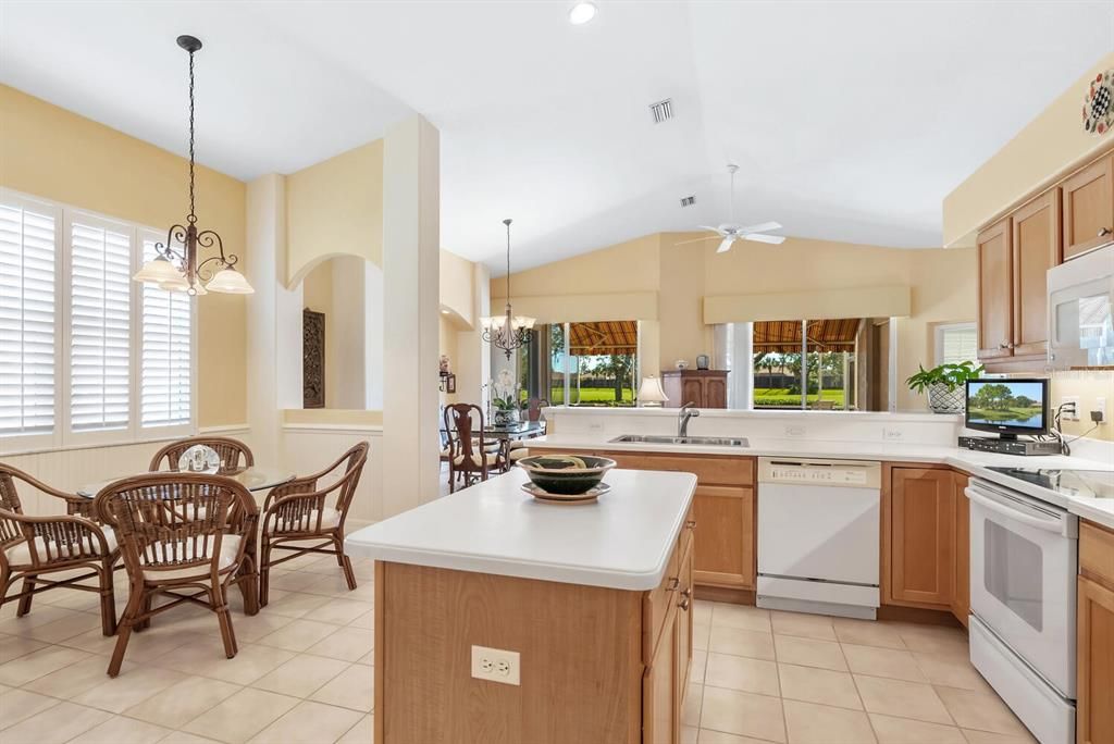 Kitchen w/ view to great room, lanai & golf course