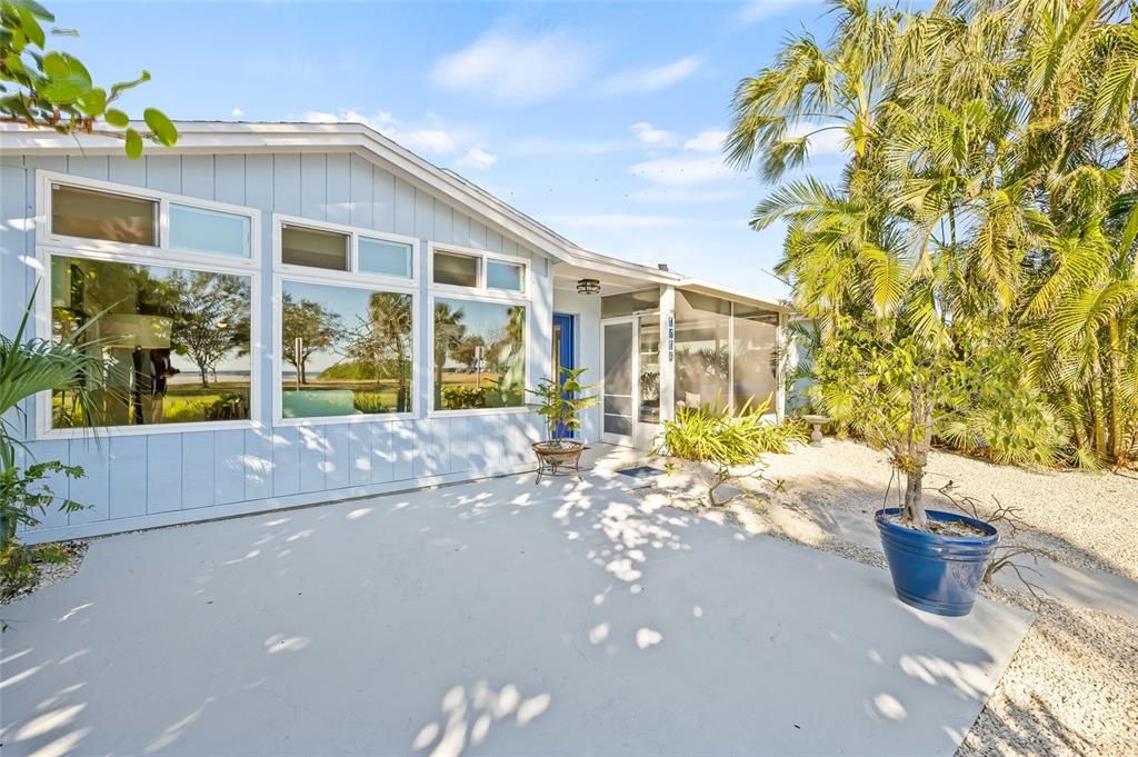 Welcome to 1519 Beach Dr SE, a charming, updated bungalow with stunning views of Tampa Bay and Lassing Park.