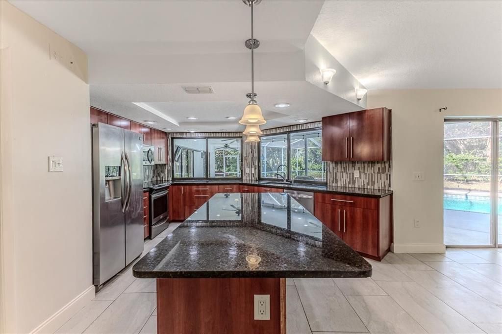 Contemporary Cherry Cabinets & Granite Counters