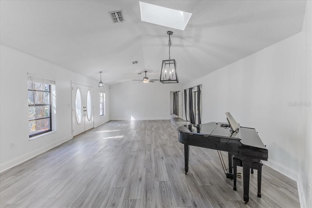 Dining & Living Room with Vaulted Ceilings & New Flooring