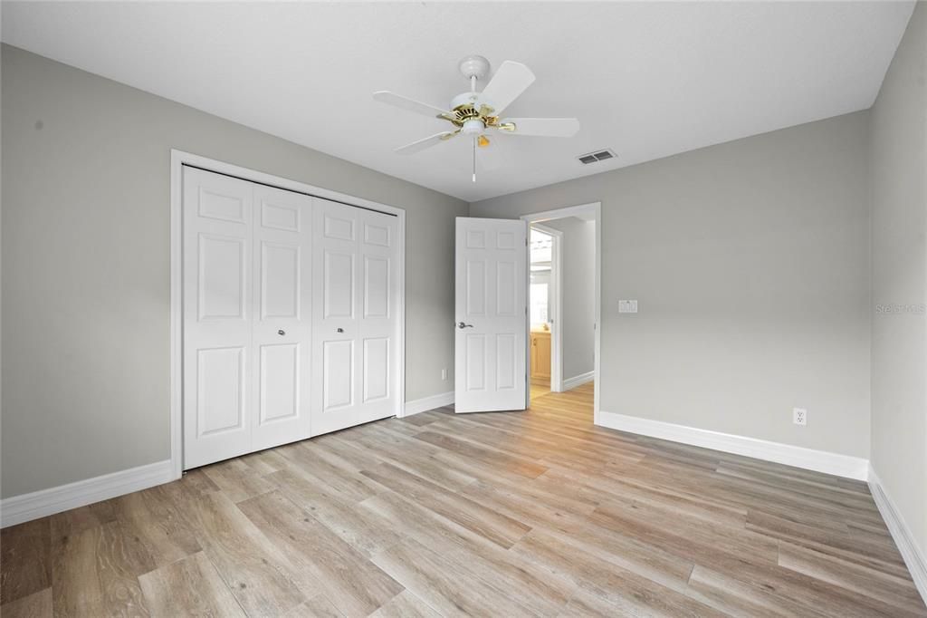 Bedroom 3Beautiful wood-look tile flooring complements the modern style.Freshly painted (2024) with plenty of natural light and versatile space.