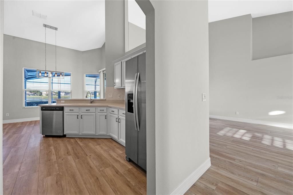 Kitchen & Dinette Renovated kitchen with stone countertops and custom pantry shelving.Newer Whirlpool stainless steel appliances (2020).Breakfast nook offers tranquil lakefront views for your morning coffee.Refinished cabinetry adds a modern yet timeless touch.