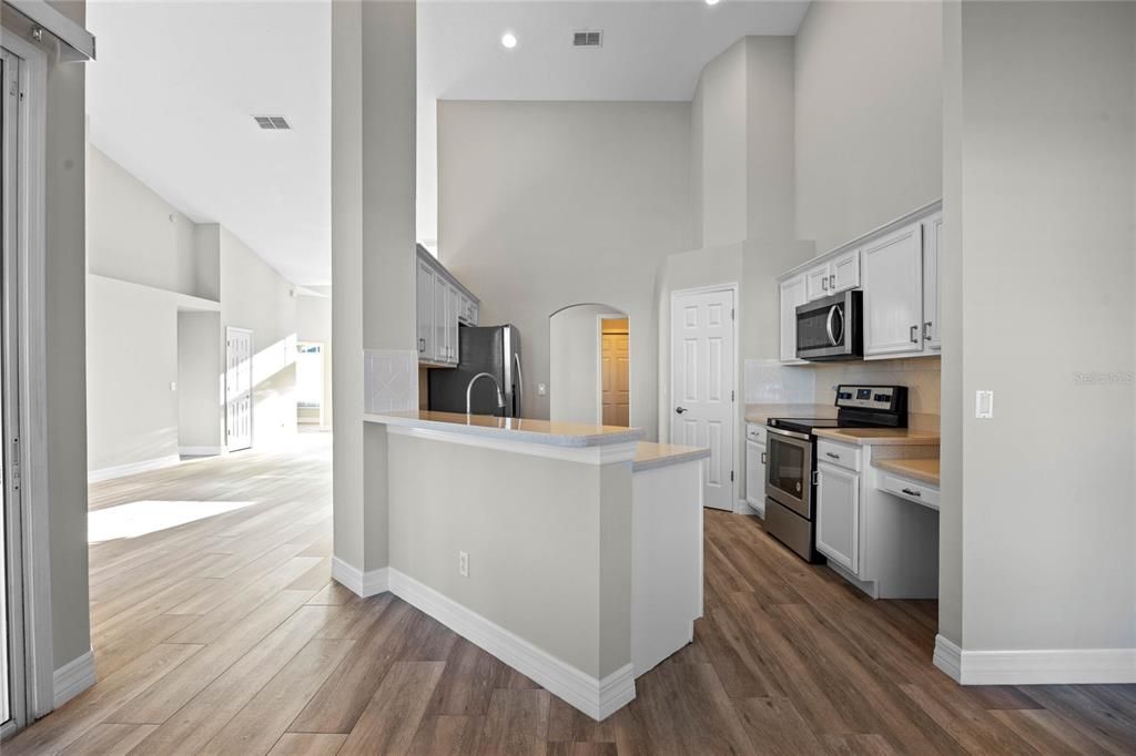 Kitchen & Dinette Renovated kitchen with stone countertops and custom pantry shelving.Newer Whirlpool stainless steel appliances (2020).Breakfast nook offers tranquil lakefront views for your morning coffee.Refinished cabinetry adds a modern yet timeless touch.