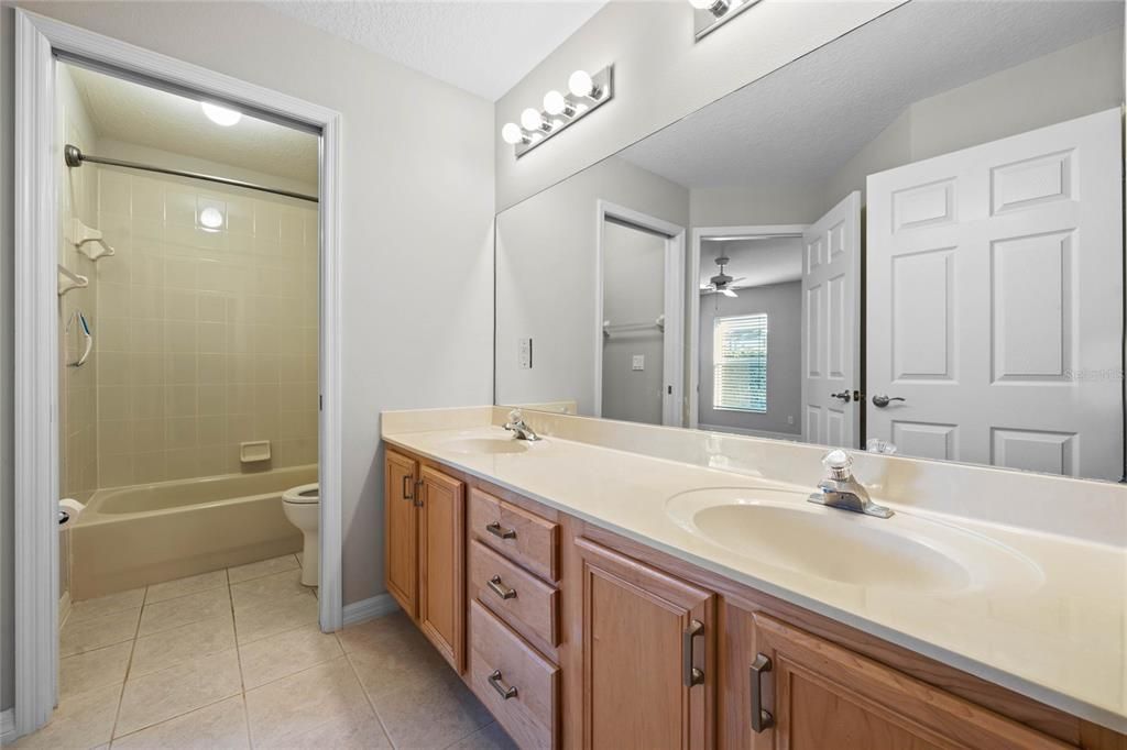 Guest BathroomFeatures dual vanities for added functionality and convenience.Direct access from Bedroom 2 for a private en suite feel.Separate room for the toilet and shower, offering privacy and versatility.