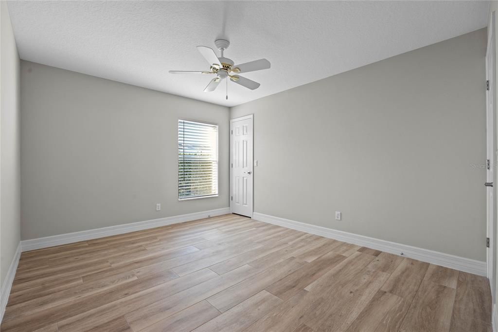 Bedroom 3Beautiful wood-look tile flooring complements the modern style.Freshly painted (2024) with plenty of natural light and versatile space.