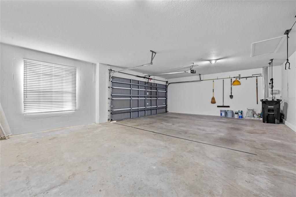 Garage & SystemsThree-car tandem garage with a storage bay and natural light.New roof (2019) and pool pump (2024) ensure low-maintenance living.Built-in Taexx pest control system and wired security system for peace of mind.