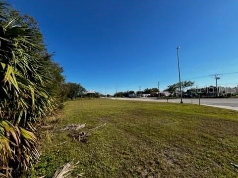 View NE toward US17 from a corner within the property.  Lander Place intersection is the distance.