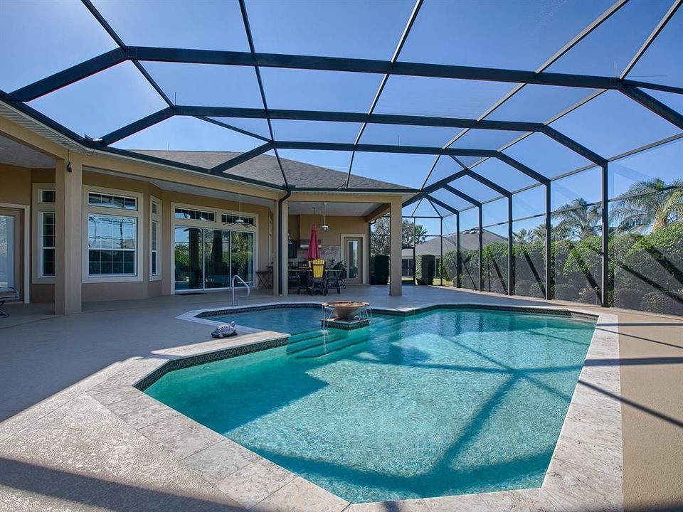 AN AMAZING POOL AND A 3500+SF OUTDOOR LIVING SPACE WITH SUMMER KITCHEN AND POOL BATH.