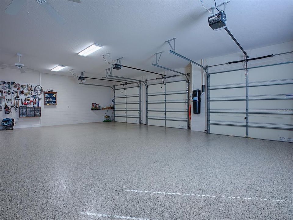 CENTRAL VACUUM SYSTEM BETWEEN THE GARAGE DOORS WHICH RUNS THROUGHOUT THE HOME.