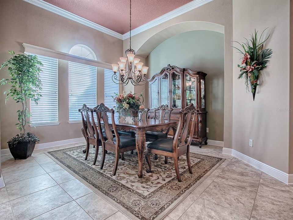 ARCHITECTURAL ARCHES THROUGHOUT THE HOME, CROWN MOLDING AND CORNICES.