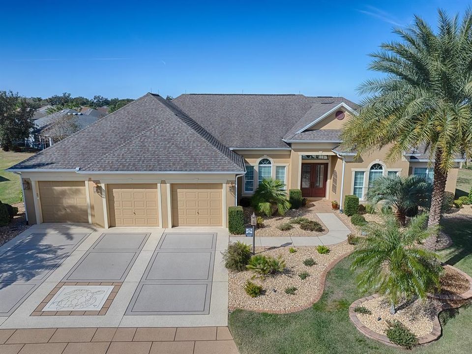 EXTRAORDINARY 4 BEDROOM, 3 BATH, GRANDVIEW PREMIER WITH OVERSIZED 3 CAR GARAGE (1000+ sf), POOL AND COMPLETE PRIVACY IN REAR LOCATED IN THE VILLAGE OF LAKE DEATON!