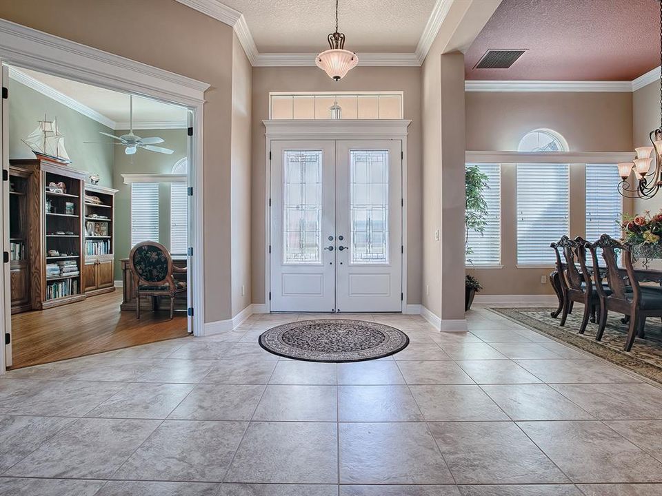 ELEGANT DOUBLE LEADED GLASS FRONT DOORS WITH TRANSOM. WHEN YOU WALK IN, THE FORMAL DINING ROOM IS ON THE LEFT AND THE 4TH BEDROOM IS ON THE RIGHT WHICH MANY USE AS AN OFFICE/DEN.