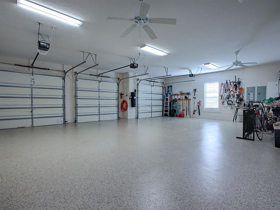 NOW THIS IS A GARAGE WITH CUSTOM POLYASPARTIC COATED FLOORING.