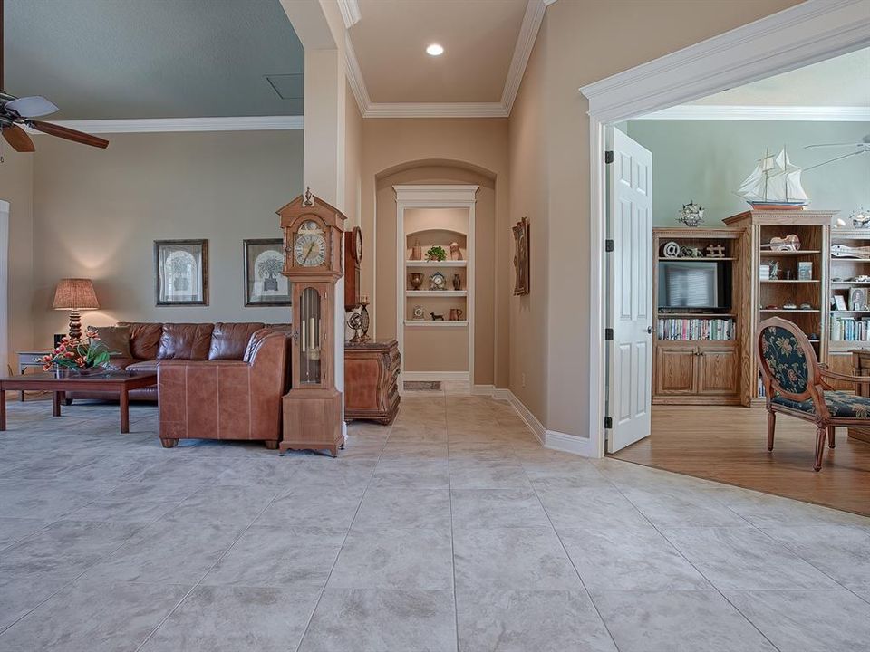 DOUBLE DOOR ENTRANCE TO THE "OFFICE". FORMAL LIVING ROOM IS ON THE LEFT, AND HALLWAY LEADS TO THE GUEST SUITE.