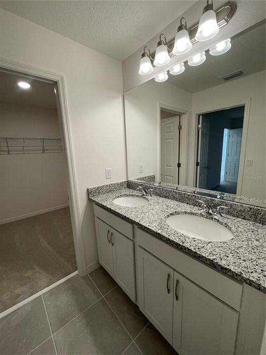 Primary Bathroom with Walk-In Closet