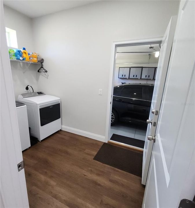 View of laundry room from entry hallway