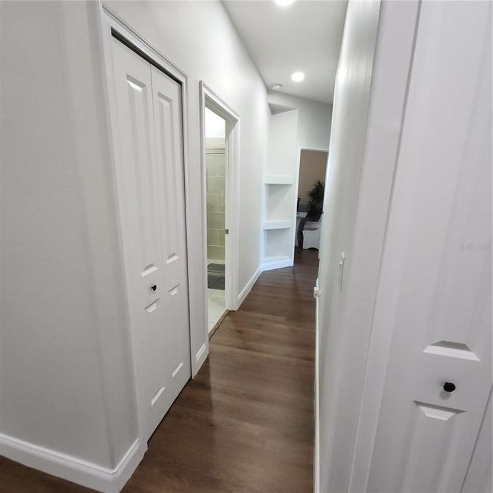 Hallway to bedrooms 2-4 and guesl full bathroom