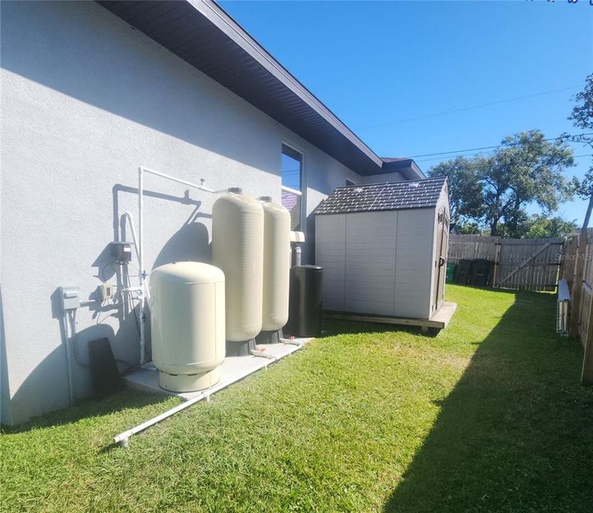 Left side of house with storage shed