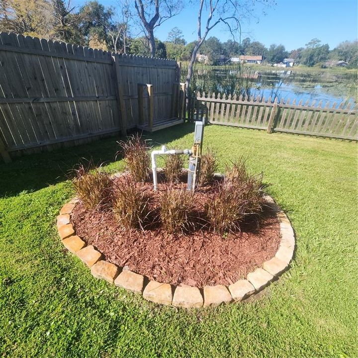 Landscaping around well in back yard