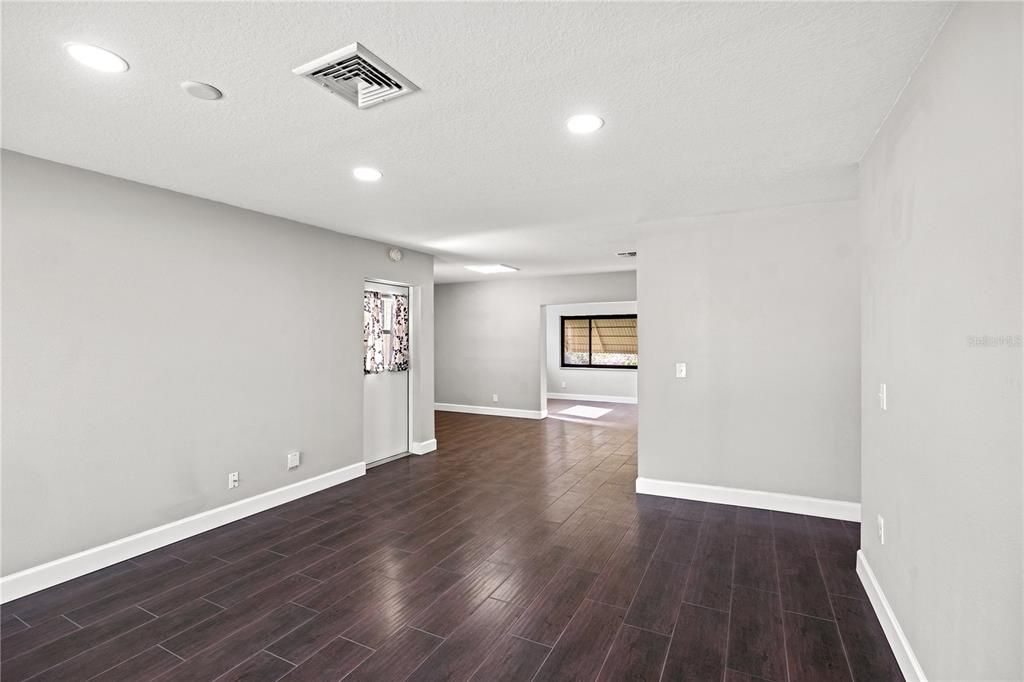 Living room looking into dining room and large florida room under air